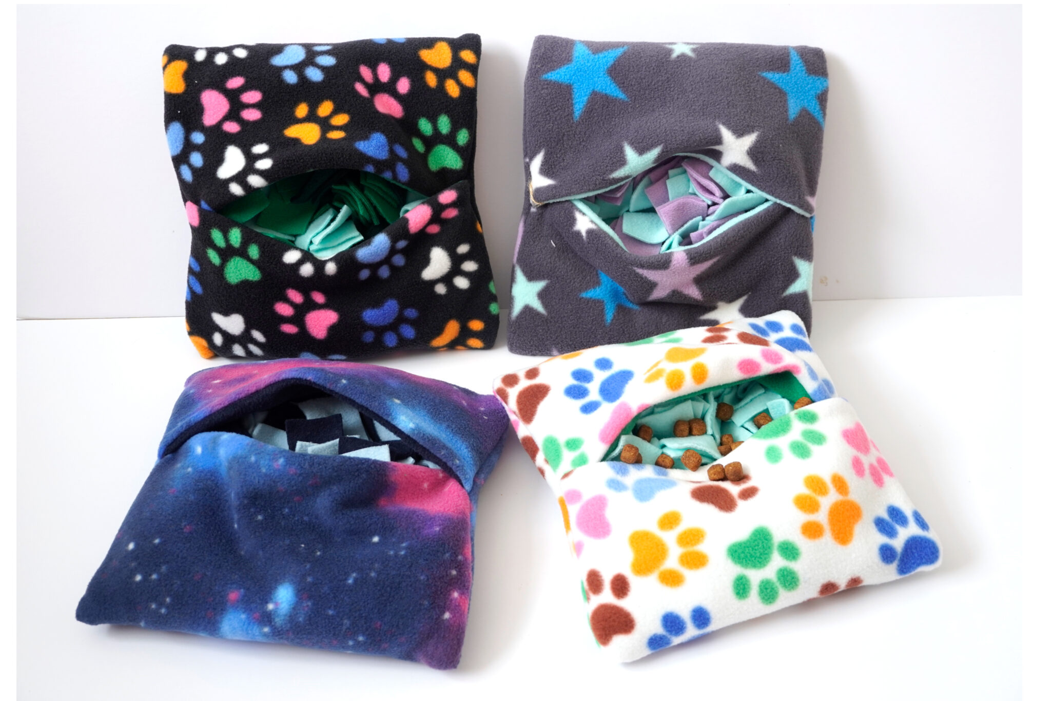 There are four different fabric to choses from, black with paw prints on, cream with paw prints on, navy blue with pink splashes, Gray with coloured stars on.